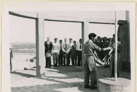 Boy Scouts raise flag at monument (ddr-densho-37-1470)