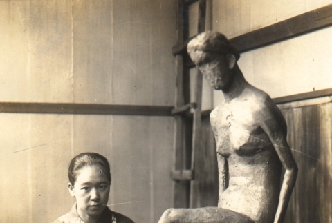 Sculptor posing with a statue (ddr-njpa-4-1908)