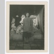 Woman standing in front of fruit stand (ddr-densho-332-2)