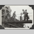 Men walking along gangplank (ddr-densho-466-157)