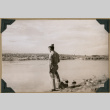 Soldier poses by the water (ddr-densho-397-40)