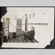Man sitting on deck of ship (ddr-densho-326-356)