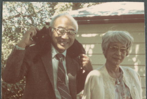 Chester and Agnes Sakura, Chester carrying a cat (ddr-densho-523-663)