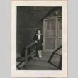 Woman standing on barracks porch (ddr-manz-10-41)