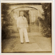 Man in white suit standing by door (ddr-densho-426-1822)