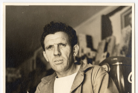 Man with a cup and cigarette (ddr-densho-542-809)