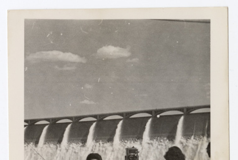 Woman stands in front of a dam (ddr-densho-404-409)