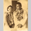 A wrestler and a woman wearing leis (ddr-njpa-4-2675)