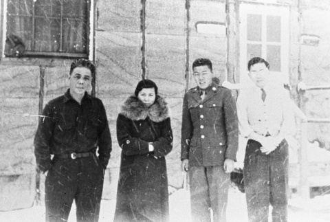 Four Japanese Americans outside a barrack (ddr-densho-20-5)