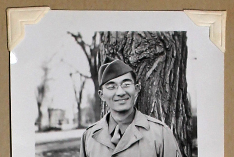 Smiling man in military uniform (ddr-densho-404-382)