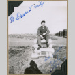 Man poses on canisters (ddr-densho-397-46)