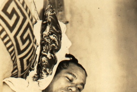 Musashiyama Takeshi reading in the hospital (ddr-njpa-4-1114)