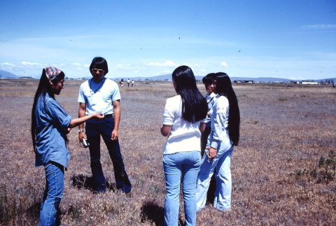 Pilgrims looking at shells at Tule Lake (ddr-densho-294-52)