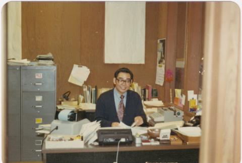 Man seated in office (ddr-densho-426-138)