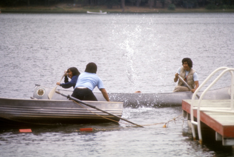 Stuart Wong trying to retrieve a bag in the water (ddr-densho-336-882)