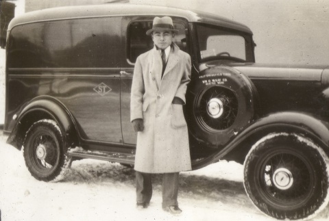 Japanese American man in front of car (ddr-densho-128-12)