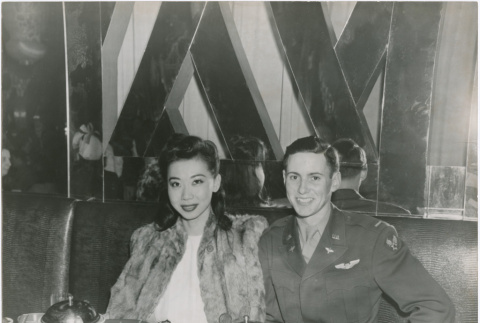 Mary Mon Toy at the China Doll Club with a military pilot (ddr-densho-367-57)