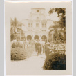 Group walking into large hotel (ddr-densho-426-1945)