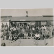 Group photo in front of the Topaz Community Cooperative Enterprises building (ddr-densho-292-2)