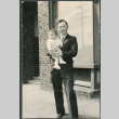 Man holding baby (ddr-densho-523-55)