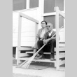 Issei couple sitting on barracks porch (ddr-densho-24-20)