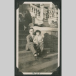 man and child sitting on steps (ddr-densho-378-553)