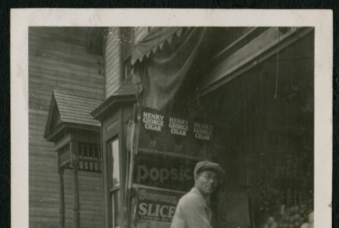 Man working at produce stand (ddr-densho-359-738)