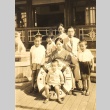 An embassy clerk's family posing on a ship (ddr-njpa-4-1999)