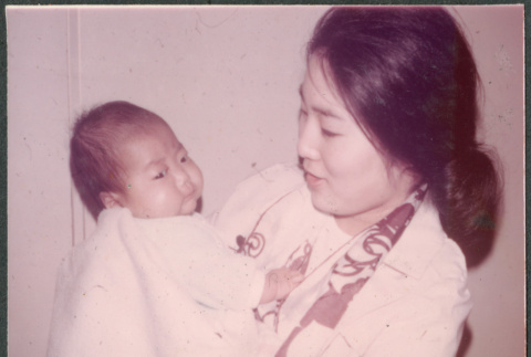 Woman holding baby (ddr-densho-523-570)