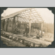 Photo of two men at a construction site (ddr-densho-483-220)