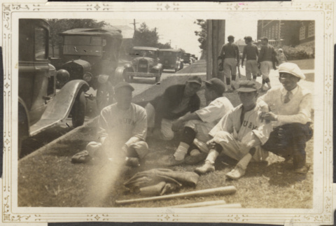 Five men sitting on side of street (ddr-densho-326-385)