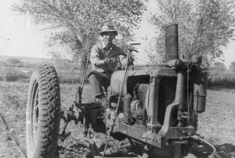 Man on a tractor (ddr-densho-187-17)
