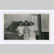 Women in front of Japanese sign (ddr-densho-402-22)