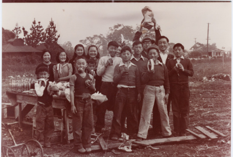 Group of children in field having a picnic (ddr-densho-458-29)