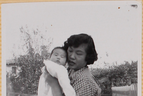Yoshiko Shiomi holding Susan Shiomi (ddr-densho-522-141)