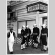 Four servicepeople and one civilian in white overalls outside sukiyaki restaurant (ddr-densho-1007-45)