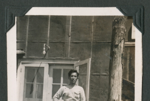 Tomio Otani outside a barrack (ddr-densho-471-73)