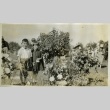 Nisei children visiting mother's gravesite (ddr-densho-182-88)