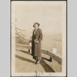 Woman standing by railing (ddr-densho-316-114)