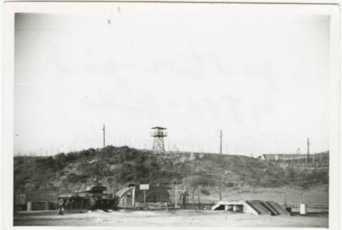 Guard tower with a tank in the foreground (ddr-densho-350-19)