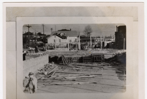 Man stands at the temple construction site (ddr-sbbt-4-140)
