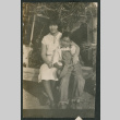 boy and girl sitting on bench (ddr-densho-378-690)