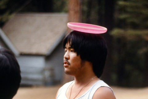 Wayne Yoshitomi playing frisbee (ddr-densho-336-921)