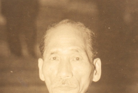 Man with a ribbon pinned to his chest (ddr-njpa-4-2381)