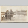 Man and woman sitting on a bench (ddr-densho-278-220)