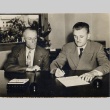 W. Harold Loper signing a document with a Veterans' Administration leader (ddr-njpa-2-628)