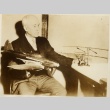 A man holding model airplanes (ddr-njpa-1-2590)