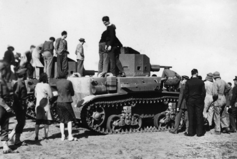 Group standing around tank (ddr-ajah-2-767)