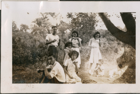 Group at picnic eating watermelon (ddr-densho-316-404)