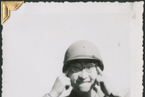 Man making face for camera (ddr-densho-434-321)
